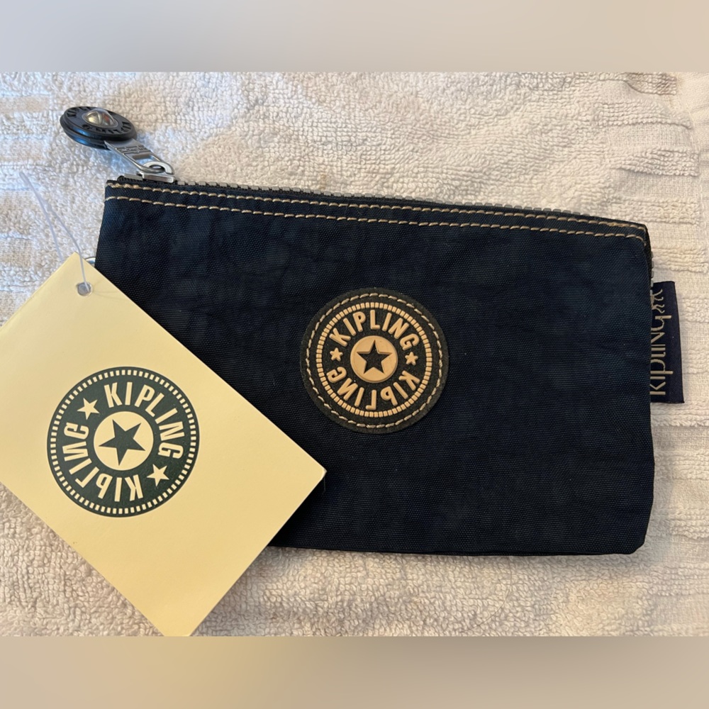Kipling navy blue zippered wristlet.